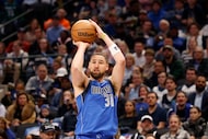 Dallas Mavericks guard Klay Thompson (31) shoots a three-point shot during the first half of...