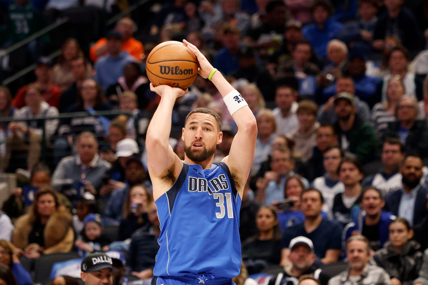 Dallas Mavericks guard Klay Thompson (31) shoots a three-point shot during the first half of...
