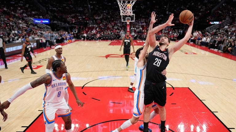 Houston Rockets' Alperen Sengun (28) shoots as Oklahoma City Thunder's...