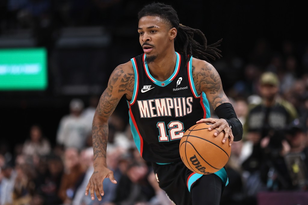 Ja Morant handles the ball during overtime against the Philadelphia 76ers at FedExForum on December 30, 2025 in Memphis, Tennessee. 