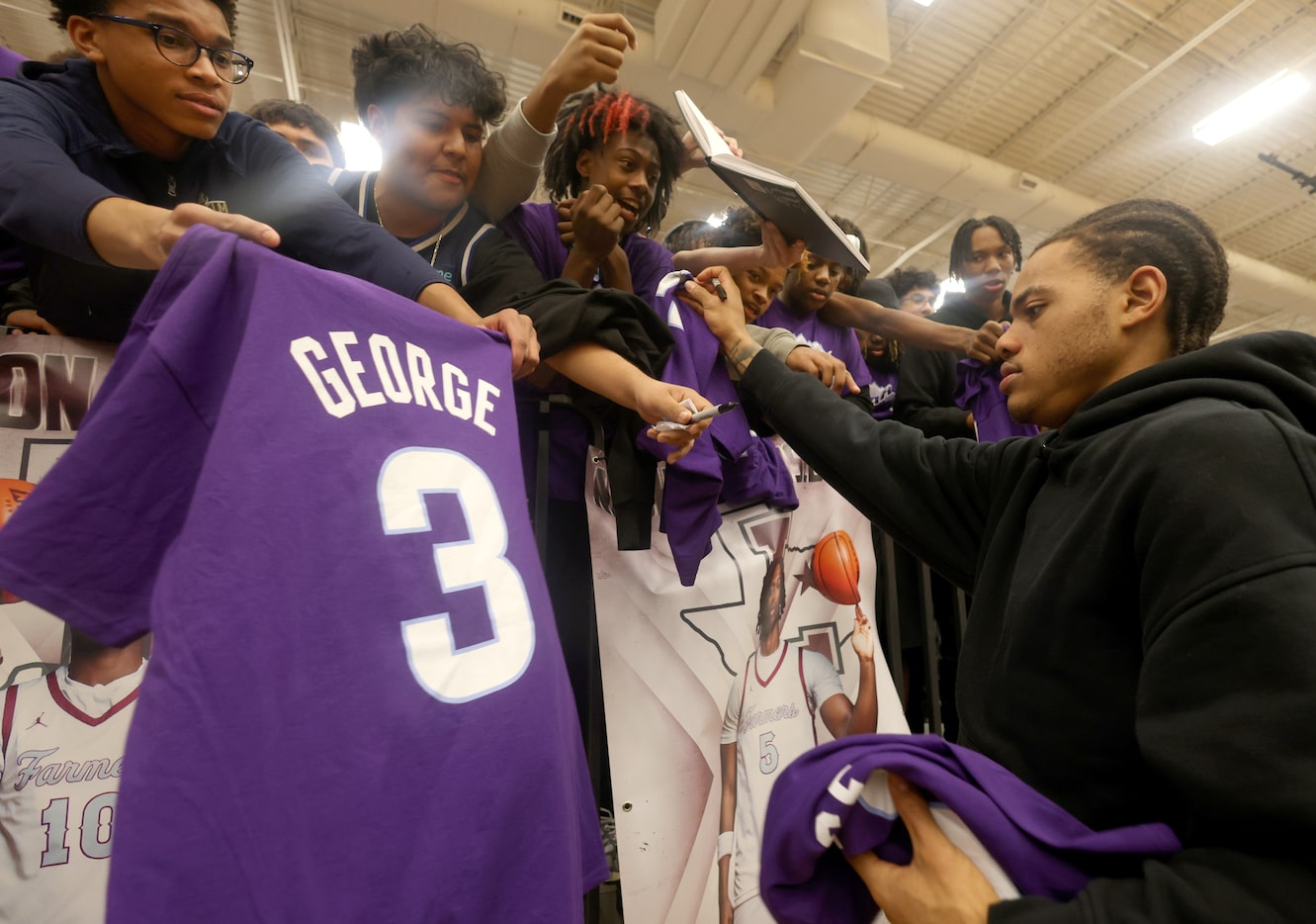 Utah Jazz guard Keyonte George, right, signs autographs for spirited fans following a...