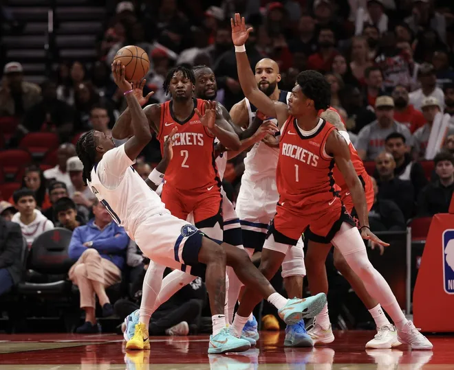 Jan 16, 2026; Houston, Texas, USA; Minnesota Timberwolves center Naz Reid (11) shoots against Houston Rockets guard Amen Thompson (1) in the second half at Toyota Center.