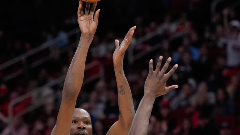 Houston Rockets forward Kevin Durant (7) shoots against New Orleans...