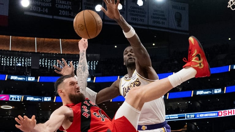 Toronto Raptors forward Sandro Mamukelashvili (54) is fouled by Los...
