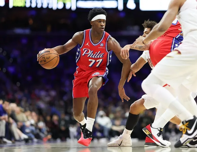 Jan 16, 2026; Philadelphia, Pennsylvania, USA; Philadelphia 76ers guard Vj Edgecombe (77) dribbles the ball against the Cleveland Cavaliers during the first quarter at Xfinity Mobile Arena.