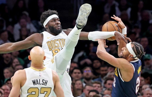 Boston Celtics center Neemias Queta (88) fouls Denver Nuggets forward Zeke Nnaji (22) during the first half at TD Garden. (Photo By Matt Stone/Boston Herald)