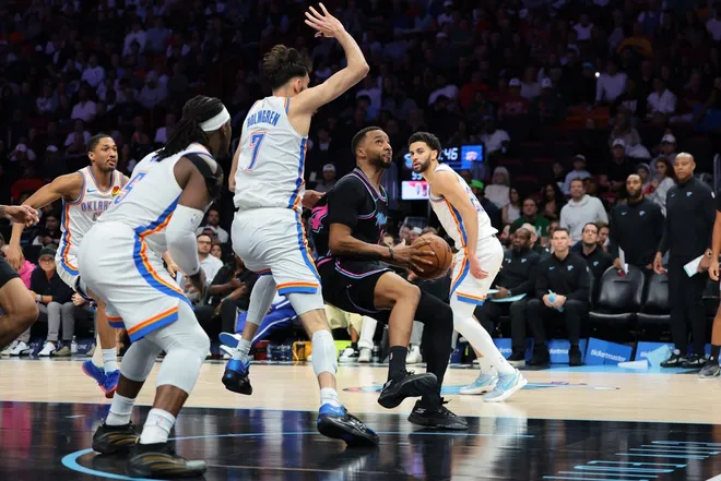Jan 17, 2026; Miami, Florida, USA; Miami Heat guard Norman Powell (24) drives to the basket against Oklahoma City Thunder center Chet Holmgren (7) during the fourth quarter at Kaseya Center.