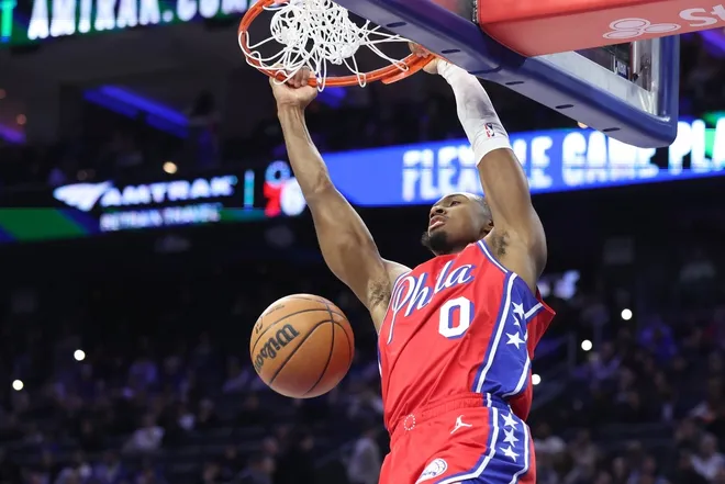 Jan 16, 2026; Philadelphia, Pennsylvania, USA; Philadelphia 76ers guard Tyrese Maxey (0) dunks the ball against the Cleveland Cavaliers during the second quarter at Xfinity Mobile Arena.