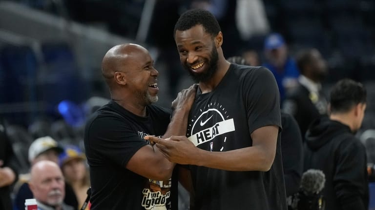Golden State Warriors assistant coach Kris Weems, left, talks with...
