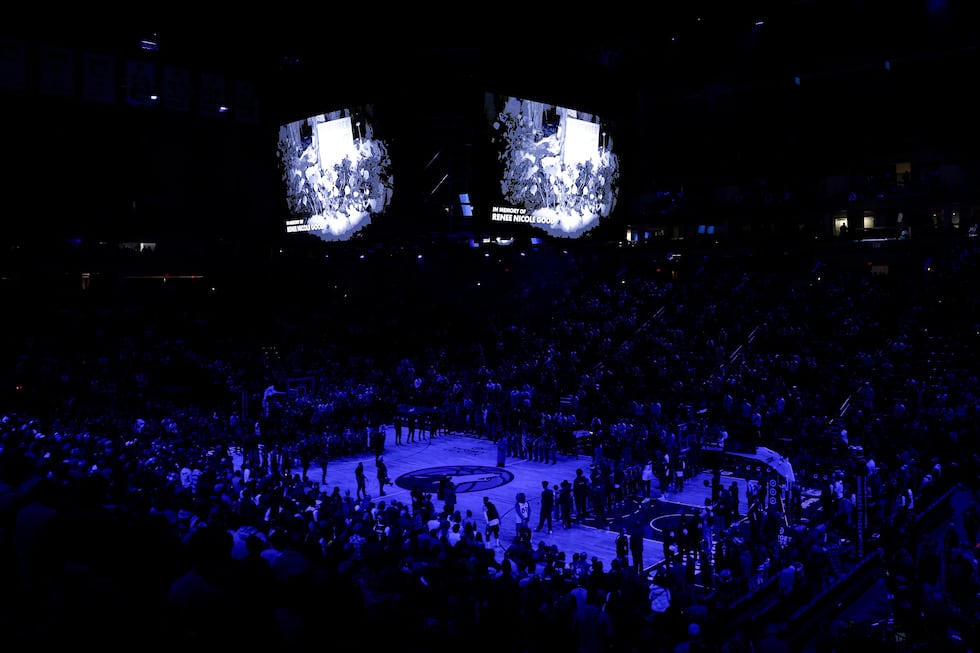 Minnesota Timberwolves and Cleveland Cavaliers players take part in a moment of silence for...