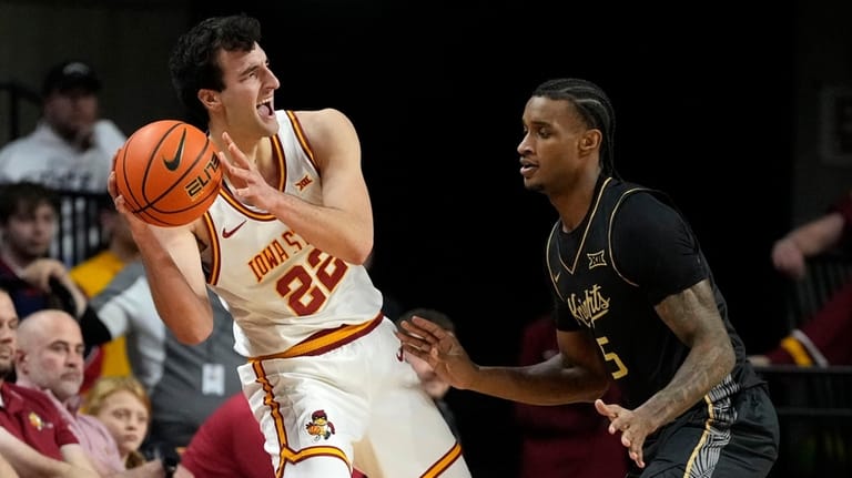 Iowa State forward Milan Momcilovic (22) looks to pass around...
