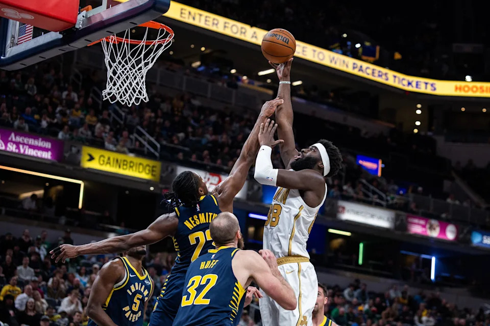 Jan 12, 2026; Indianapolis, Indiana, USA; Boston Celtics center Neemias Queta (88) shoots the ball while Indiana Pacers guard/forward Aaron Nesmith (23) defends in the second half at Gainbridge Fieldhouse. Mandatory Credit: Trevor Ruszkowski-Imagn Images
