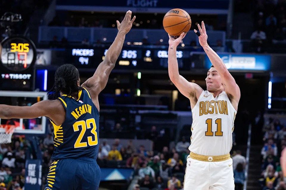 Jan 12, 2026; Indianapolis, Indiana, USA; Boston Celtics guard Payton Pritchard (11) shoots the ball while Indiana Pacers guard/forward Aaron Nesmith (23) defends in the second half at Gainsbridge Fieldhouse. Mandatory Credit: Trevor Ruszkowski-Imagn Images