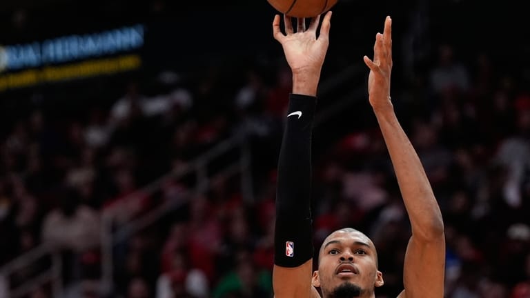San Antonio Spurs forward Victor Wembanyama (1) shoots against Houston...
