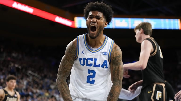UCLA guard Donovan Dent (2) celebrates his basket during the...