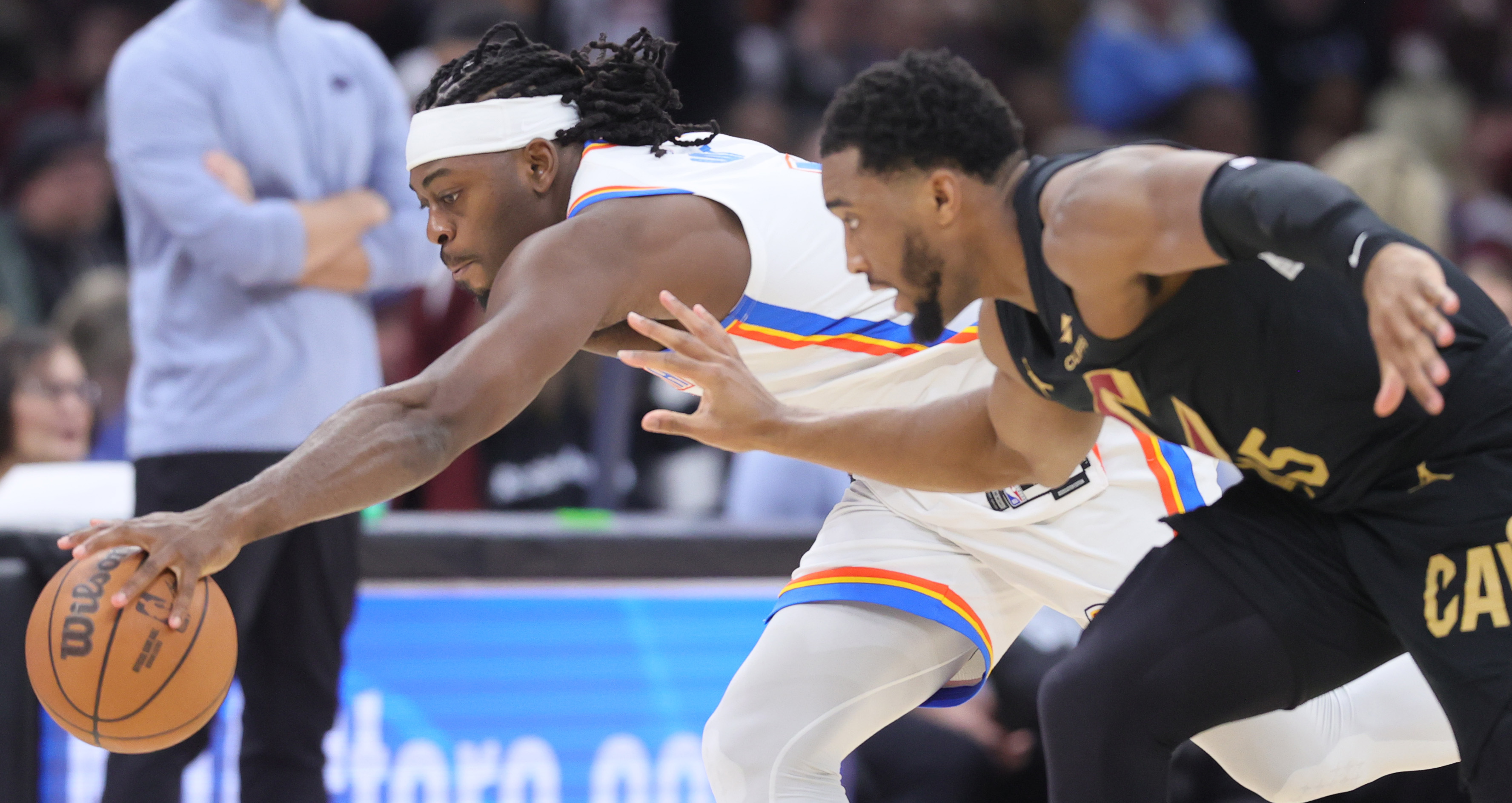 Oklahoma City Thunder guard Luguentz Dort steals the basketball from Cleveland Cavaliers guard Donovan Mitchell for a turnover in the second half.