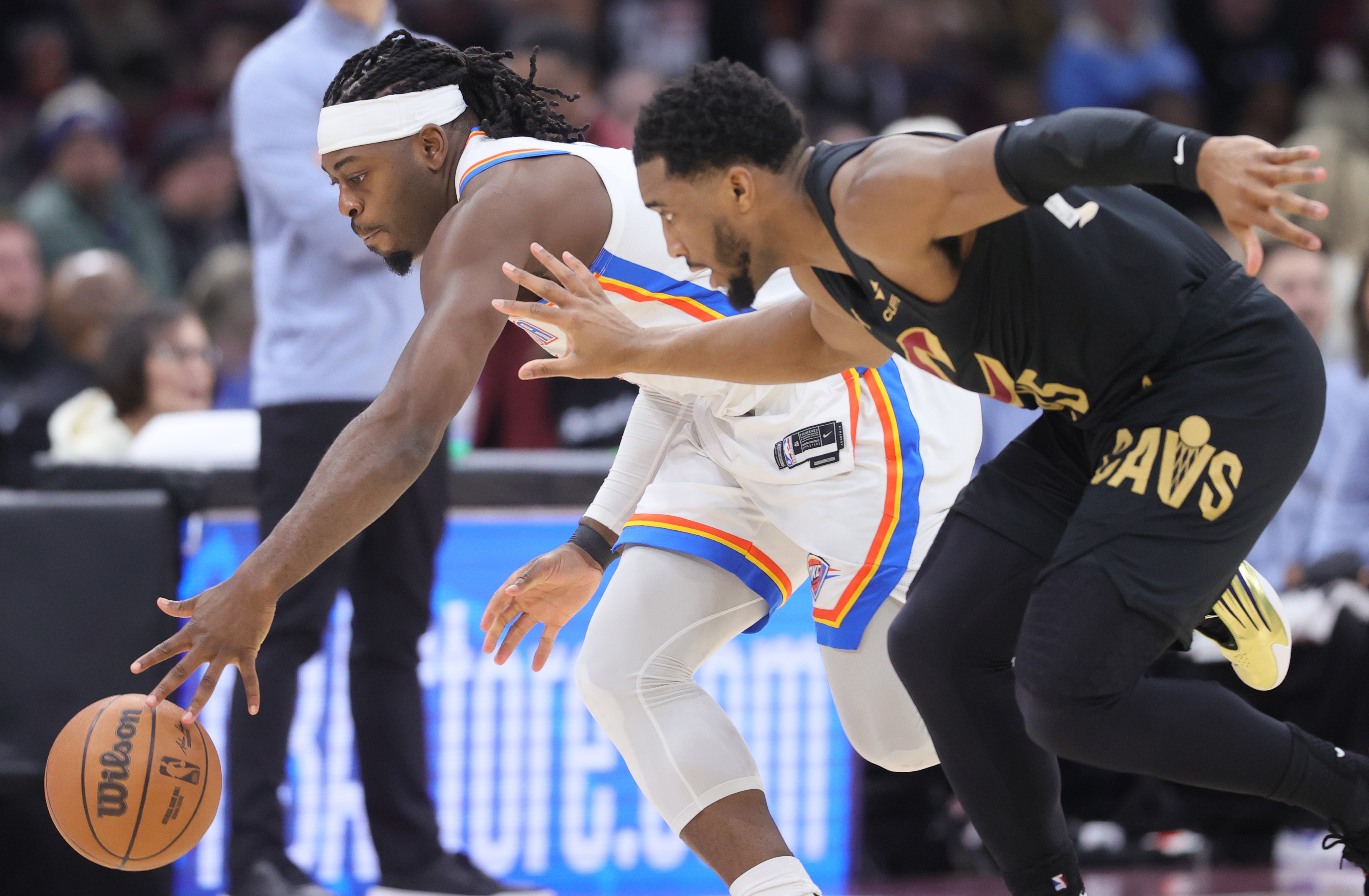 Oklahoma City Thunder guard Luguentz Dort steals the basketball from Cleveland Cavaliers guard Donovan Mitchell for a turnover in the second half.