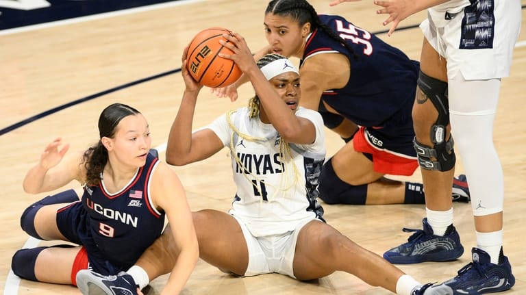 Georgetown guard Destiny Agubata (4) looks to pass the ball...