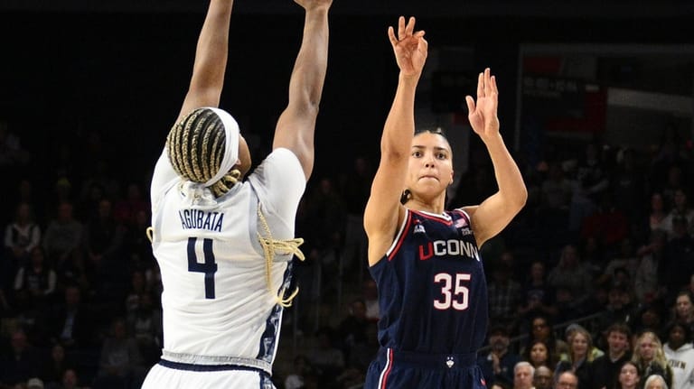 UConn guard Azzi Fudd (35) shoots against Georgetown guard Destiny...