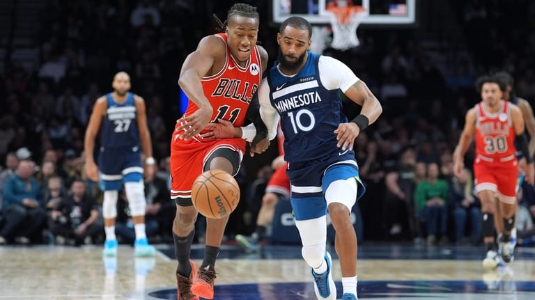 Chicago Bulls guard Ayo Dosunmu (11) and Minnesota Timberwolves guard...
