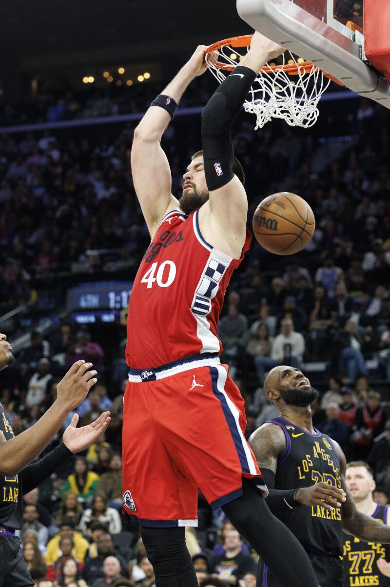 Clippers center Ivica Zubac scores on a reverse dunk in the fourth quarter of the Clippers' 112-104 win.