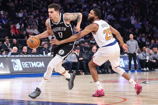 Jan 21, 2026; New York, New York, USA; Brooklyn Nets forward Michael Porter Jr. (17) drives past New York Knicks guard Mikal Bridges (25) in the third quarter at Madison Square Garden.