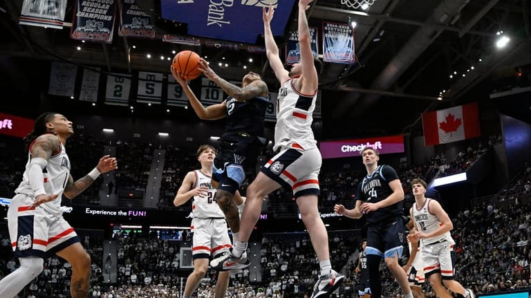 Villanova guard Bryce Lindsay (2) shoots as UConn forward Alex...