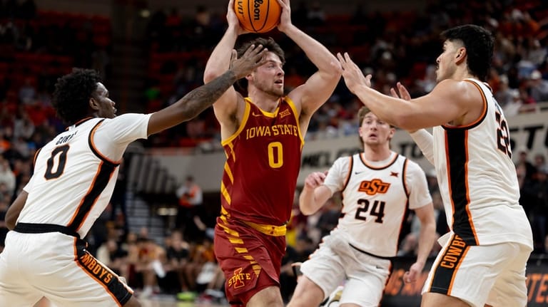 Iowa State guard Nate Heise (0) runs past Oklahoma State...