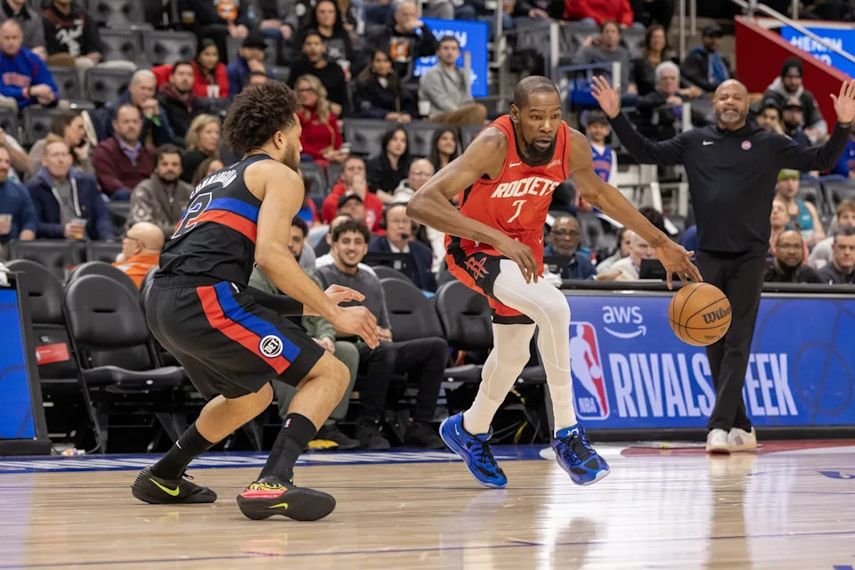 Jan 23, 2026; Detroit, Michigan, USA; Detroit Pistons guard Cade Cunningham (2) defends against Houston Rockets forward Kevin Durant (7) during the first half at Little Caesars Arena. Mandatory Credit: David Reginek-Imagn Images