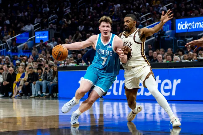 Jan 17, 2026; San Francisco, California, USA; Golden State Warriors guard De'anthony Melton (8) guards Charlotte Hornets guard Kon Knueppel (7) during the third quarter at Chase Center. Mandatory Credit: John Hefti-Imagn Images