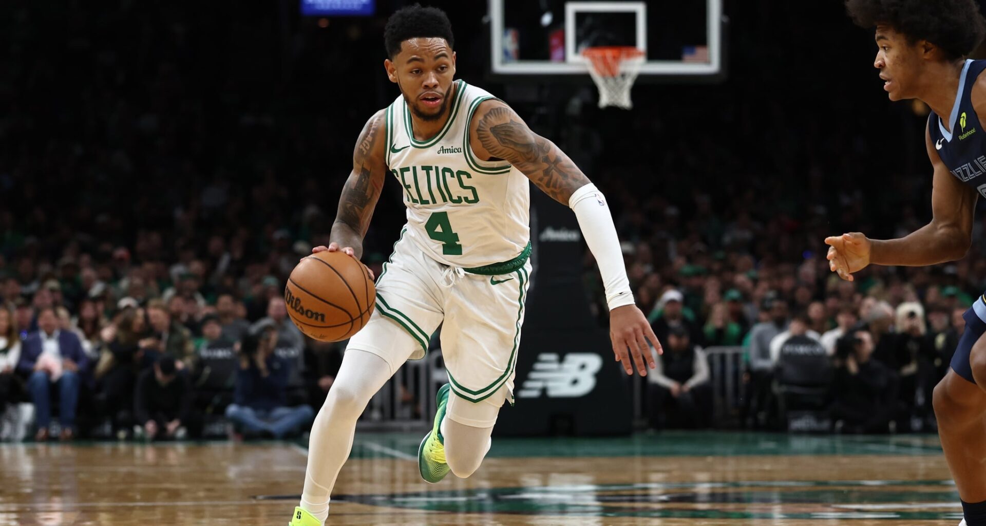 Boston Celtics guard Anfernee Simons attacks Memphis Grizzlies defender Jaylen Wells