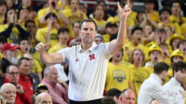 Nebraska head coach Fred Hoiberg directs his team against Michigan...