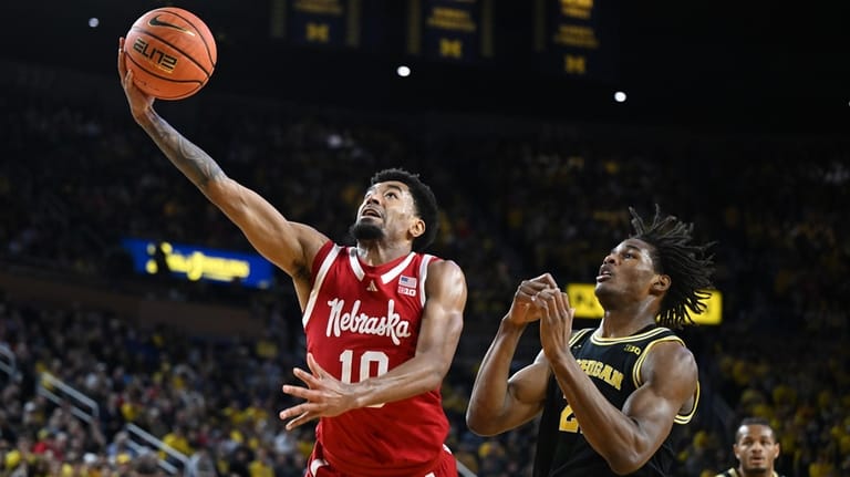 Nebraska guard Jamarques Lawrence (10) shoots the ball against Michigan...