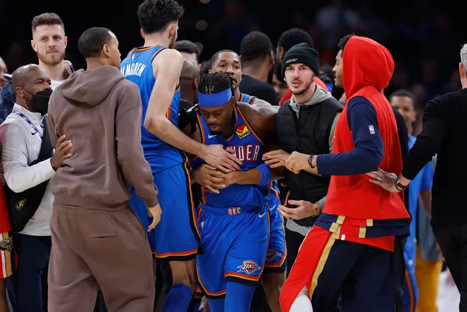 Jan 27, 2026; Oklahoma City, Oklahoma, USA; Oklahoma City Thunder guard Luguentz Dort (5) is escorted away from a scuffle with New Orleans Pelicans guard Jeremiah Fears (0) during the second half at Paycom Center. Mandatory Credit: Alonzo Adams-Imagn Images