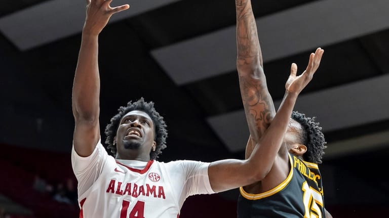 Alabama center Charles Bediako (14) shoots and scores past Missouri...