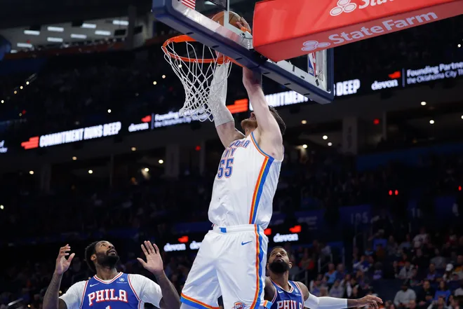 Dec 28, 2025; Oklahoma City, Oklahoma, USA; Oklahoma City Thunder center Isaiah Hartenstein (55) dunks against the Philadelphia 76ers during the second half at Paycom Center. Mandatory Credit: Alonzo Adams-Imagn Images