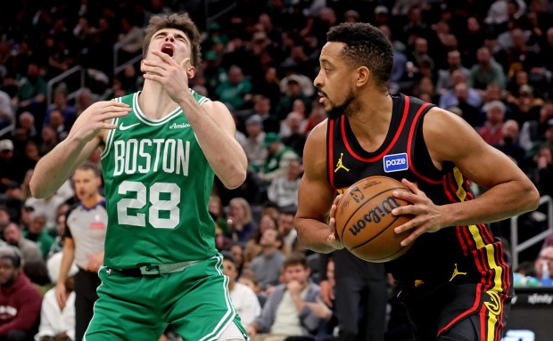 Atlanta Hawks guard CJ McCollum (3) fouls Boston Celtics guard Hugo Gonzalez during the second half. (Photo By Matt Stone/Boston Herald)
