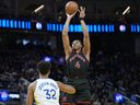 Scottie Barnes of the Toronto Raptors shoots over Trayce Jackson-Davis of the Golden State Warriors during a game earlier this month.