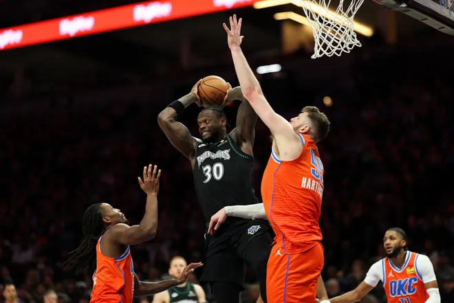 MINNEAPOLIS, MINNESOTA - JANUARY 29: Julius Randle #30 of the Minnesota Timberwolves passes the ball against Isaiah Hartenstein #55 of the Oklahoma City Thunder in the fourth quarter at Target Center on January 29, 2026 in Minneapolis, Minnesota. The Timberwolves defeated the Thunder 123-111. NOTE TO USER: User expressly acknowledges and agrees that, by downloading and or using this photograph, User is consenting to the terms and conditions of the Getty Images License Agreement. (Photo by David Berding/Getty Images)