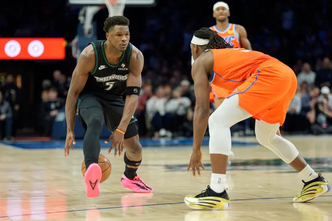 Jan 29, 2026; Minneapolis, Minnesota, USA; Minnesota Timberwolves guard Anthony Edwards (5) is defended by Oklahoma City Thunder guard Luguentz Dort (5) in the second quarter at Target Center. Mandatory Credit: Matt Blewett-Imagn Images