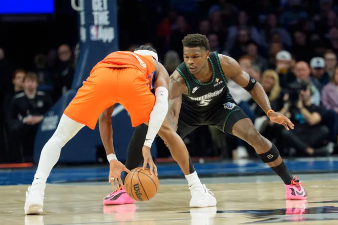 Jan 29, 2026; Minneapolis, Minnesota, USA; Minnesota Timberwolves guard Anthony Edwards (5) defends Oklahoma City Thunder guard Shai Gilgeous-Alexander (2) in the first quarter at Target Center. Mandatory Credit: Matt Blewett-Imagn Images