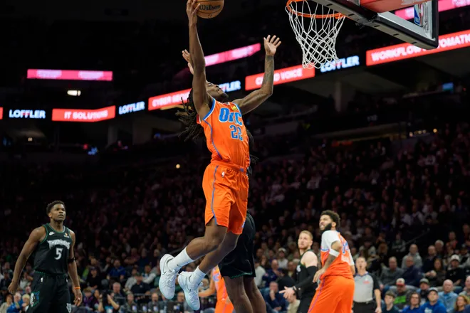 Jan 29, 2026; Minneapolis, Minnesota, USA; Oklahoma City Thunder guard Cason Wallace (22) drives to the basket against the Minnesota Timberwolves in the fourth quarter at Target Center. Mandatory Credit: Matt Blewett-Imagn Images