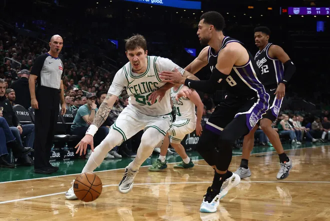 Jan 30, 2026; Boston, Massachusetts, USA; Boston Celtics guard Baylor Scheierman (55) drives on Sacramento Kings guard Zach LaVine (8) during the second half at TD Garden. Mandatory Credit: Winslow Townson-Imagn Images