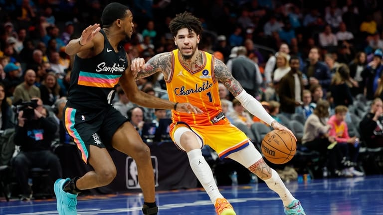 Charlotte Hornets guard LaMelo Ball (1) drives against San Antonio...