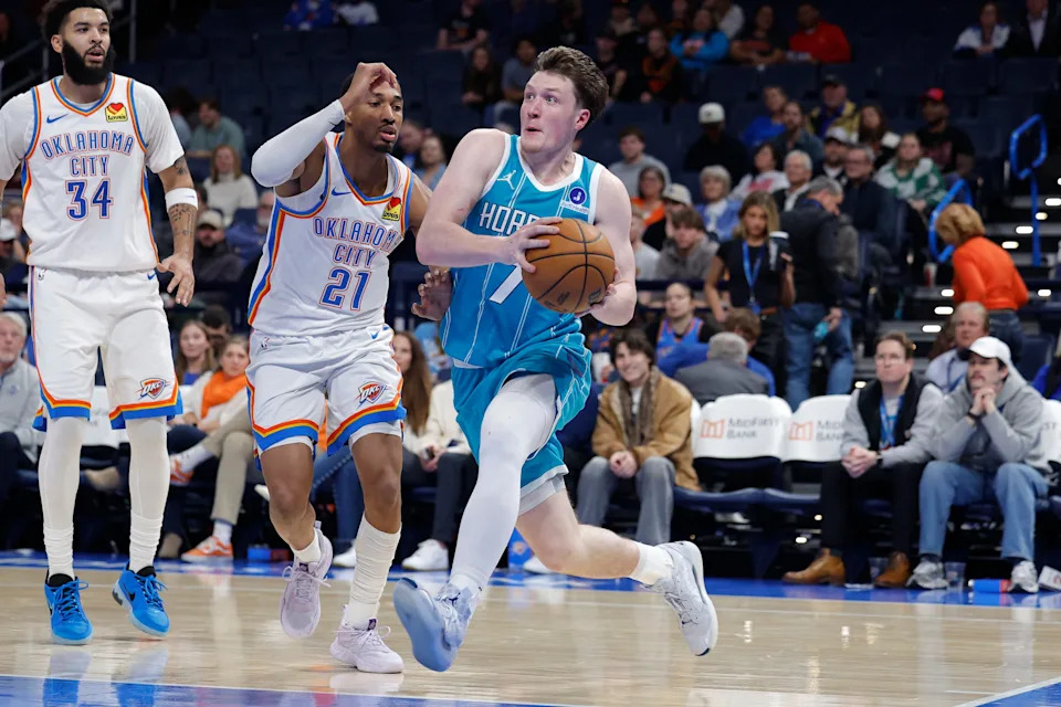 Jan 5, 2026; Oklahoma City, Oklahoma, USA; Charlotte Hornets guard Kon Knueppel (7) drives to the basket past Oklahoma City Thunder guard Aaron Wiggins (21) during the second half at Paycom Center. Mandatory Credit: Alonzo Adams-Imagn Images