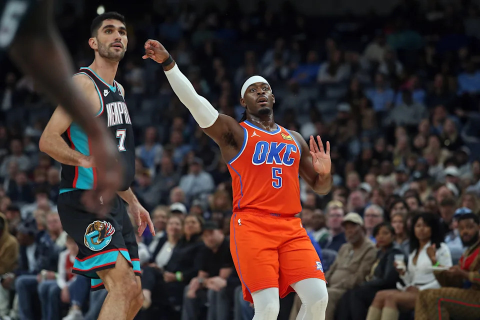 Jan 9, 2026; Memphis, Tennessee, USA; Oklahoma City Thunder guard Luguentz Dort (5) holds after shooting for three during the second quarter against the Memphis Grizzlies at FedExForum. Mandatory Credit: Petre Thomas-Imagn Images