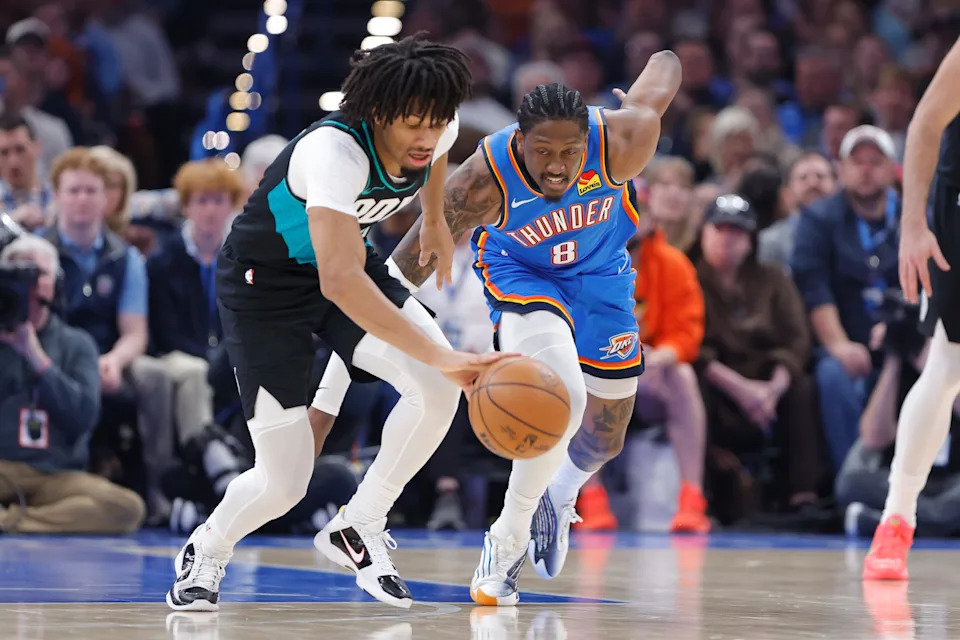 Dec 31, 2025; Oklahoma City, Oklahoma, USA; Portland Trail Blazers guard Shaedon Sharpe (17) and Oklahoma City Thunder guard Jalen Williams (8) reach for a loose ball during the second quarter at Paycom Center. Mandatory Credit: Alonzo Adams-Imagn Images