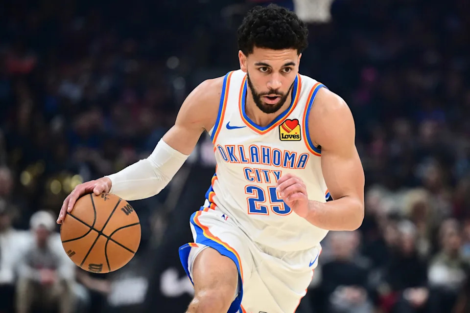 Jan 19, 2026; Cleveland, Ohio, USA; Oklahoma City Thunder guard Ajay Mitchell (25) brings the ball up court against the Cleveland Cavaliers during the first half at Rocket Arena. Mandatory Credit: Ken Blaze-Imagn Images