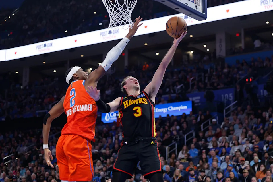 Dec 29, 2025; Oklahoma City, Oklahoma, USA; Atlanta Hawks guard Luke Kennard (3) shoots as Oklahoma City Thunder guard Shai Gilgeous-Alexander (2) defends during the first half at Paycom Center. Mandatory Credit: Alonzo Adams-Imagn Images