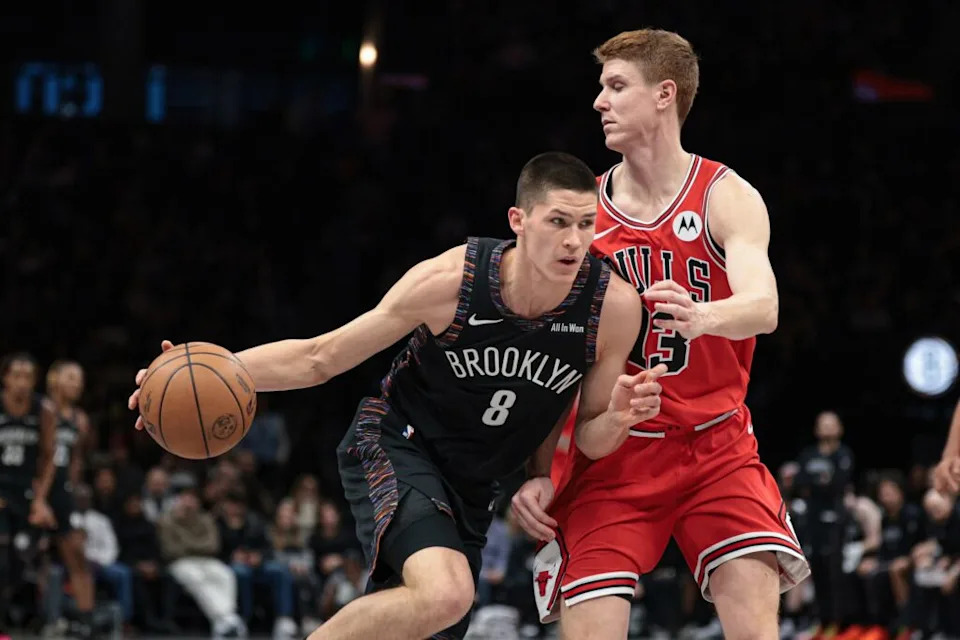 Jan 16, 2026; Brooklyn, New York, USA; Brooklyn Nets guard Egor Demin (8) drives to the basket against Chicago Bulls guard Kevin Huerter (13) during the first half at Barclays Center. Mandatory Credit: Vincent Carchietta-Imagn Images